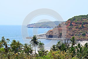 Seaside of Arabian sea with Hills and Palm Trees, Velaneshwar Beach, Ratnagiri, Maharashtra, India - A Natural Background