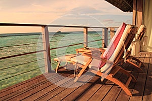 Seaside balcony with two chairs
