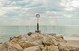 Coastal rocks scene along Bournemouth beach in Dorset.