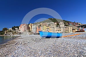 Seaside with boat in Sori, Italy photo