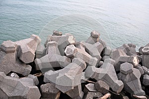 Seaside breakwater tetrapod with concrete blocks