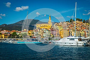 Seaside buildings and marina with sailing boats, yachts in Menton