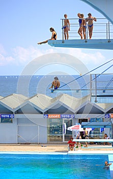 Seaside diving boards teens swimmers