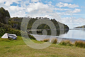 Seaside landscape with camping site in Stewart Island, New Zealand