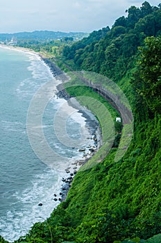 Seaside landscape nature photography with green hills and railroad. Batumi botanical garden. Sceneric view with bright