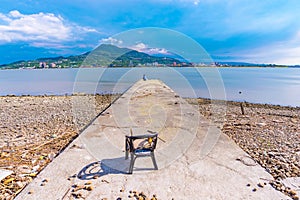 Seaside pier on a pebble beach