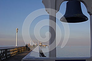 Seaside pier, with ships bell