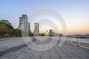 Seaside Plaza and modern buildings, city skyline of Xiamen Shipping Center at dusk