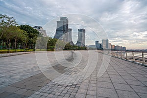 Seaside Plaza and modern buildings, city skyline of Xiamen Shipping Center at dusk