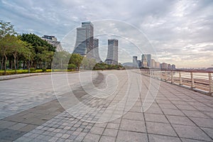 Seaside Plaza and modern buildings, city skyline of Xiamen Shipping Center at dusk