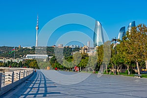 Seaside promenade with Flame towers on background in Baku, Azerb