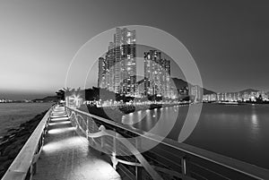 Seaside promenade and high rise residential building in Hong Kong city