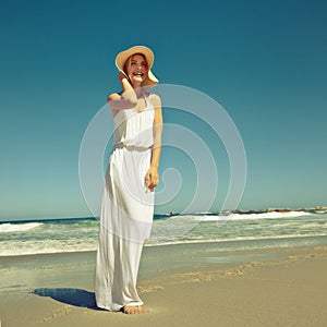 Seaside styling. Shot of a beautiful young woman enjoying a day at the beach.