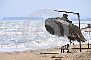 Seaside in the summer near to beach with sun visors