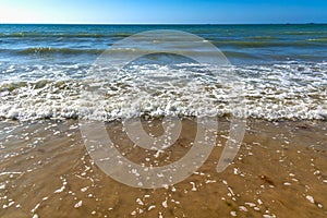 Seaside and waves, beach with sand, water, shell