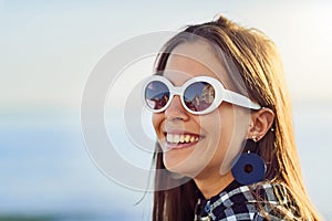 The seaside is where I belong. an attractive young woman spending a day by the ocean.