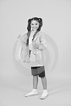 Season is changing. small girl raincoat. active schoolgirl waterproof raincoat. water resistant clothes. good mood. feel