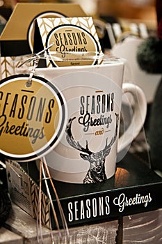 Season greetings mugs closeup, Christmas merchandise