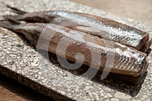 Season of new Dutch herring fresh salted fish ready to eat, traditional food in Netherlands