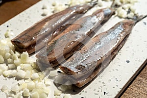 Season of new Dutch herring fresh salted fish ready to eat, traditional food in Netherlands