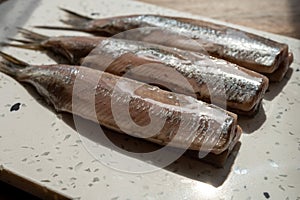 Season of new Dutch herring fresh salted fish ready to eat, traditional food in Netherlands