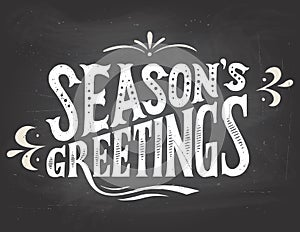 Season's greetings on chalkboard background