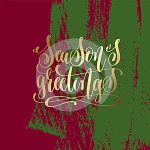 Season`s greetings - gold hand lettering on green and purple photo