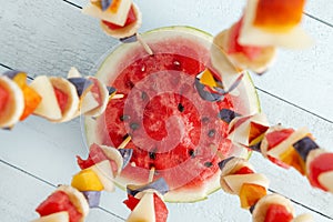 Seasonal fruit salad served on barbecue sticks