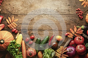 seasonal fruits and vegetables concept layout with copyspace. autumn harvest on a rustic wooden background framed.