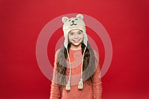 Seasonal health care. kid fashion. Warm knitting tips. happy little girl in earflap hat. holiday activity outdoor. small