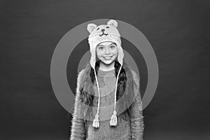 Seasonal health care. kid fashion. Warm knitting tips. happy little girl in earflap hat. holiday activity outdoor. small