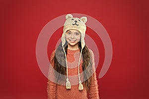 seasonal health care. kid fashion. Warm knitting tips. happy little girl in earflap hat. holiday activity outdoor. small