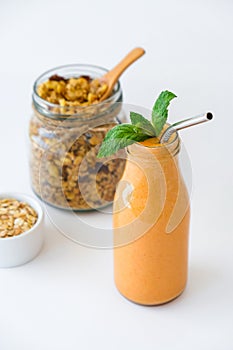 Seasonal pumpkin carrot smoothie drink detox with eco metal drinking straw Glass jar granola muesli oatmeal breakfast