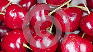 Seasonal red berry. Rotated organic red cherries background.