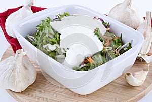 Seasonal salad in a white bowl