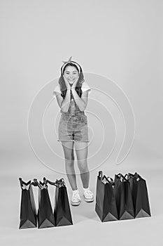 Seasonal sales. Shocking discount. Shopping day. Fashion boutique. Girl shopping. Fashion shop. Little girl with