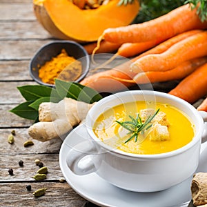 Seasonal spicy fall autumn creamy pumpkin and carrot soup