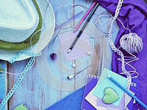 Seasonal summer composition of a pair of felt hearts, paper with a pencil, notebooks and decor