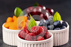 Seasonal summer fruits in small cups