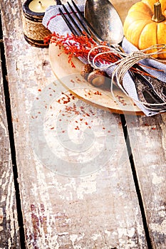 Seasonal table setting with decorative pumpkin