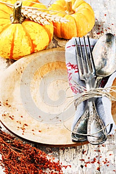 Seasonal table setting with decorative pumpkins
