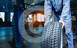 Seasonal tire changeover in auto service.