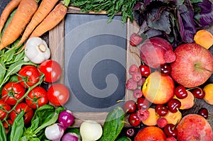 seasonal vegetables, fruits and berries around an empty frame