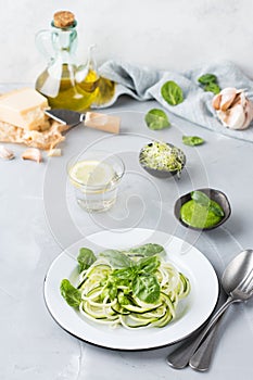 Seasonal zucchini spaghetti pasta noodles with spinach pesto sauce