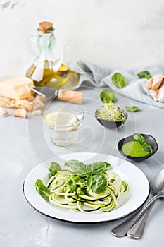 Seasonal zucchini spaghetti pasta noodles with spinach pesto sauce