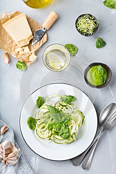 Seasonal zucchini spaghetti pasta noodles with spinach pesto sauce