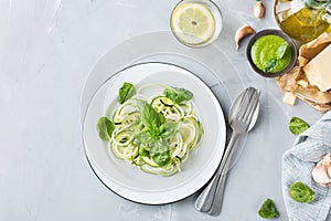 Seasonal zucchini spaghetti pasta noodles with spinach pesto sauce