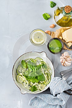 Seasonal zucchini spaghetti pasta noodles with spinach pesto sauce
