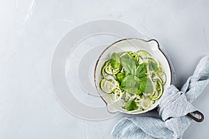 Seasonal zucchini spaghetti pasta noodles with spinach pesto sauce