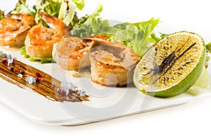 Seasoned Juicy Cocktail Shrimp Plate Closeup with vegetables